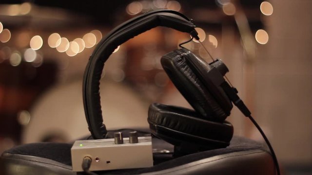 Pan of Headphones in a Recording Studio