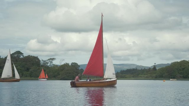 Incredible handmade wooden clinker built Mermaid sailboat on lake
