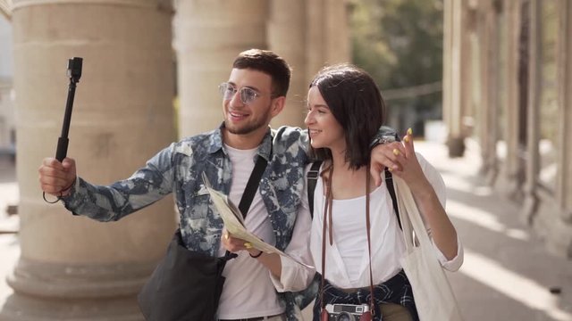 Man and woman traveling through Europe together taking videos