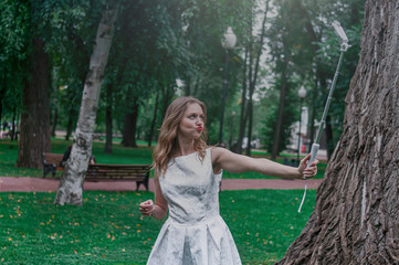 Happy yong women girls taking selfie at park