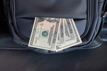 Dollars in the pocket of the bag. American Money