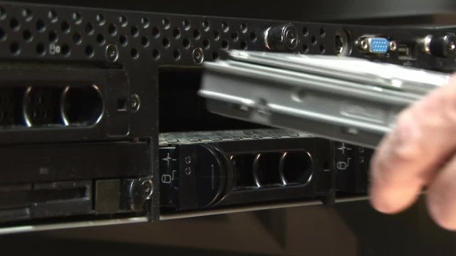 technition replacing hard drives in a network server