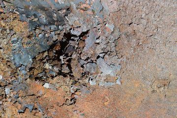 Flakes of rust on a sheet of rusty iron. Background of rust. Corrosion of metal