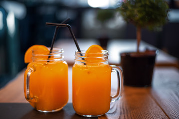 Cocktail in mug with oranges slice. Mug delicious refreshing drink with orange