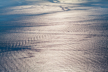 Reflections sun light in the surface of sea water waves