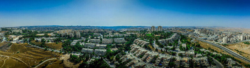 Fototapeta na wymiar Aerial view of Jewish residential single family home neighborhoods on French Hill or Givaat Tzarfatit in Northern Jerusalem with Hadassah hospital