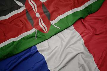 waving colorful flag of france and national flag of kenya.