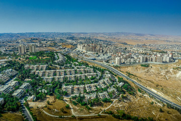 Divided Jerusalem French Hill Jewish neighborhood separated by the security concrete wall from the Palestinian village of Shuafat with a checkpoint