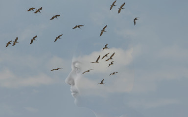 Double exposure image concept of a girl thinking in the sky with clouds and birds