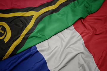 waving colorful flag of france and national flag of Vanuatu ,.