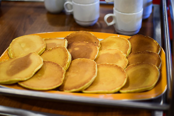 Pancakes on the dish. Traditional Norwegian pastries.