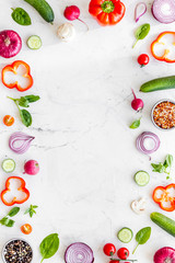 Frame of colorful vegetables on marble background top view mock up