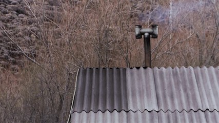 Chimney With Smoke In A Poor House In The Forest, Patagonia, Argentina.  - Powered by Adobe