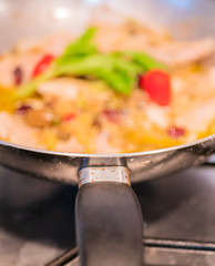Sautéed cod with tomato, raisins, pine nuts, celery, red onion, oil, pepper and olives and olives