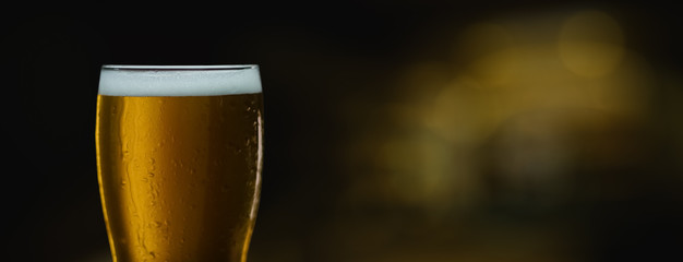 glass of cold beer with foam