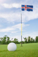 Obraz premium Iceland flag on golf course putting green with a ball near the hole