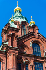 Fototapeta na wymiar Uspenski Cathedral in Helsinki, Finland. Sunny day with clear blue sky
