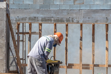 Fototapeta premium Sao Paulo, Brazil, July 22, 2019. Construction worker on a construction site in the south of Sao Paulo