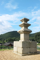 Fototapeta na wymiar Three story stone pagoda and village scenery in Seoak-dong, Gyeongju, South Korea