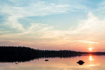 Beautiful sunset over lake in the Leivonmaki National Park, Finland