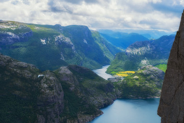 Preikestolen massive cliff (Norway, Lysefjorden summer morning view). Beautiful natural vacation hiking walking travel to nature destinations concept. July 2019
