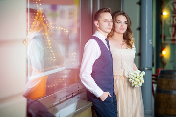 Naklejka premium Portrait of Happy Married couple Together Against Shop Window Outdoors.
