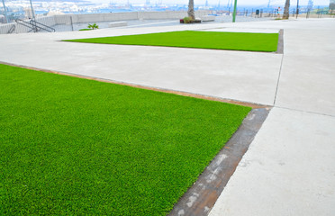 City landscaping technique with artificial turf surface.