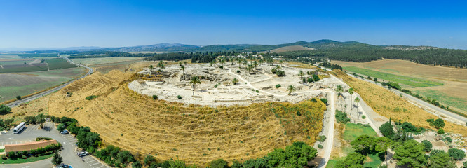 Aerial panorama of ancient city of Tel Megiddo archaeological park, site of the biblical Armageddon...