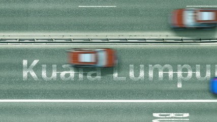 Top down view of the highway with revealing Kuala lumpur text. Driving in Malaysia intro clip