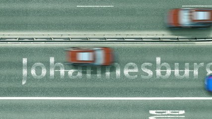 Aerial top-down view of the road. Cars reveal Johannesburg text. Travel to South Africa conceptual clip