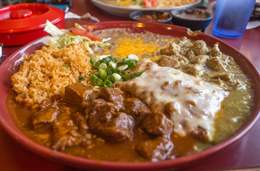 Authentic Mexican chimichanga pork burrito with sour cream jalapeno and cilantro