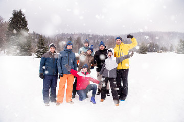 portrait of group young people in beautiful winter landscape
