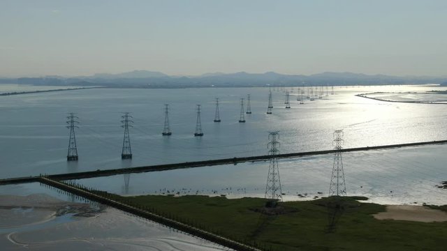 Transmission towers on the sea.