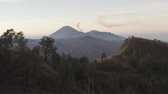 Showing the Bromo volcano from a drone point of view. The scene shows the Mount Bromo and the volcanoes.