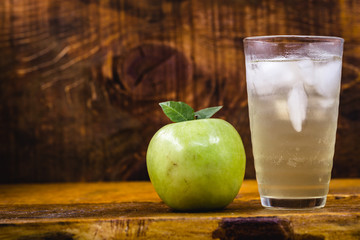 Apple spritzer (apfelschorle) pitcher, Glass pitcher of homemade spritzer served with crushed ice...