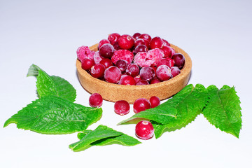 Frozen beautiful juicy ripe natural organic raspberries and cranberries. Healthy diet, diet, sweet tasty vitamins for breakfast, lunch or dinner, a good harvest