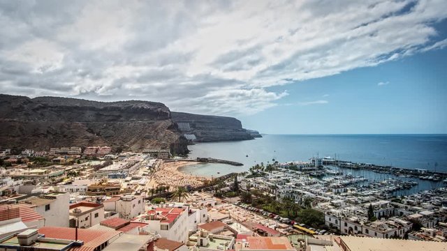 Timelapse of a nice summer day on Gran Canaria with a panoramic view over the famous city of Puerto de Mogan. 4k 4096x2304