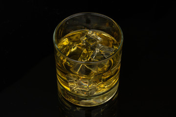 Whiskey in the rocks, Glass of whiskey with ice cubes