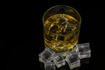 Whiskey in the rocks, Glass of whiskey with ice cubes