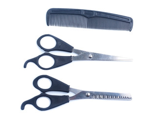 Comb with scissors  on a white background