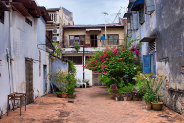 narrow street with lots of flowers in old town, Malacca 