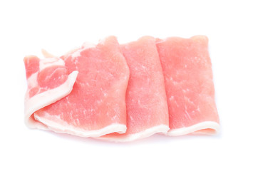 Raw pork meat with parsley herb leaves isolated on white background