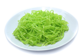 green noodles on dish isolated on white background