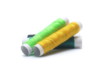 Spools with color threads isolated on white background