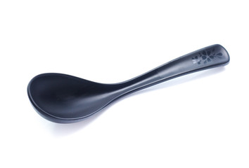 plastic black spoon, isolated on white background