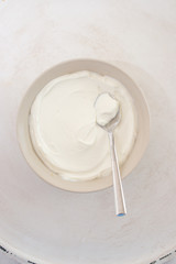 natural greek yogurt in cup on