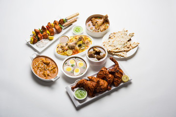 Assorted Indian Non Vegetarian food recipe served in a group. Includes Chicken Curry, Mutton Masala, Anda/egg curry, Butter chicken, biryani, tandoori murg, chicken-tikka and naan/roti for ramadan