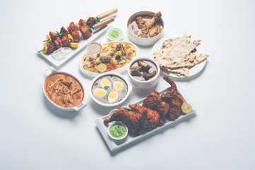 Assorted Indian Non Vegetarian food recipe served in a group. Includes Chicken Curry, Mutton Masala, Anda/egg curry, Butter chicken, biryani, tandoori murg, chicken-tikka and naan/roti for ramadan