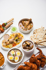 Assorted Indian Non Vegetarian food recipe served in a group. Includes Chicken Curry, Mutton Masala, Anda/egg curry, Butter chicken, biryani, tandoori murg, chicken-tikka and naan/roti