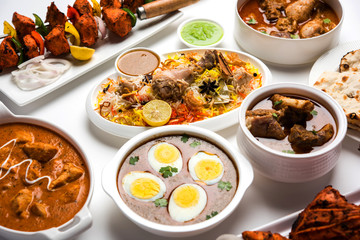 Assorted Indian Non Vegetarian food recipe served in a group. Includes Chicken Curry, Mutton Masala, Anda/egg curry, Butter chicken, biryani, tandoori murg, chicken-tikka and naan/roti